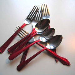 Cutlery Pieces with Red Handles by Anne Marchand part of 'Continuity in Diversity'